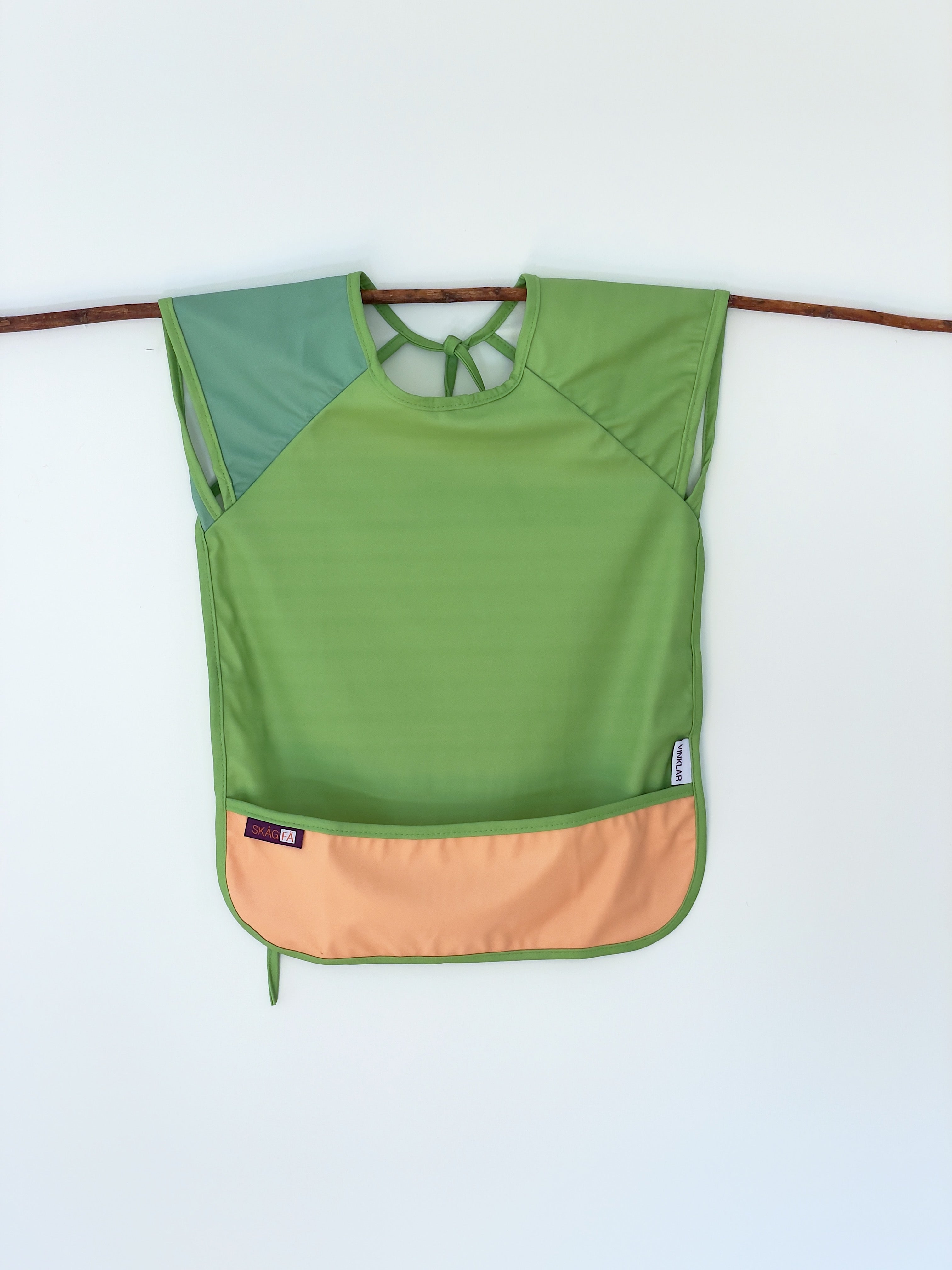 Baby's first apron for family cooking session, featuring colorful and child-friendly design, perfect for engaging young children in kitchen activities safely. Award winner company brand