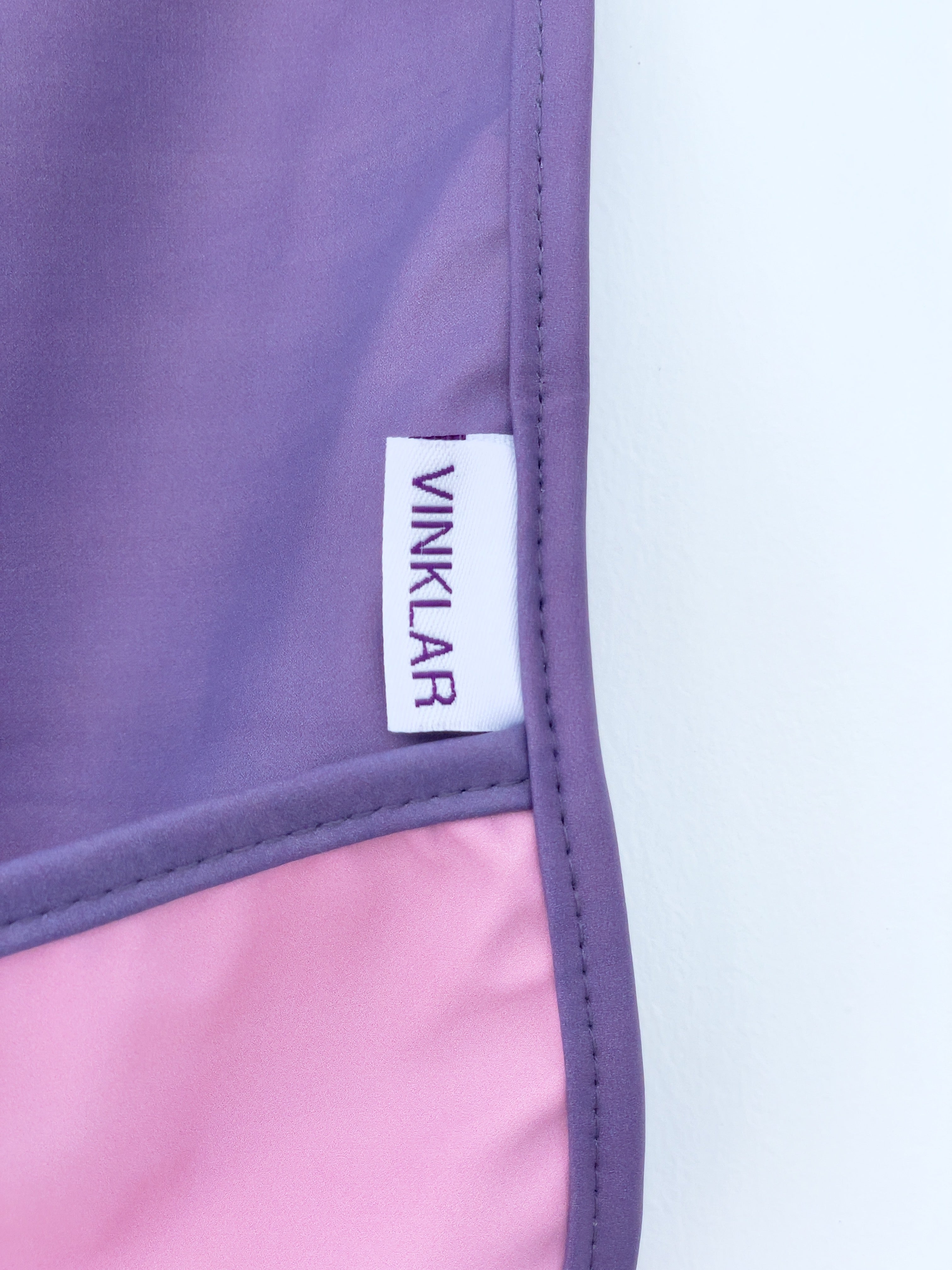 Baby's first apron for family cooking session, featuring colorful and child-friendly design, perfect for engaging young children in kitchen activities safely. Award winner company brand