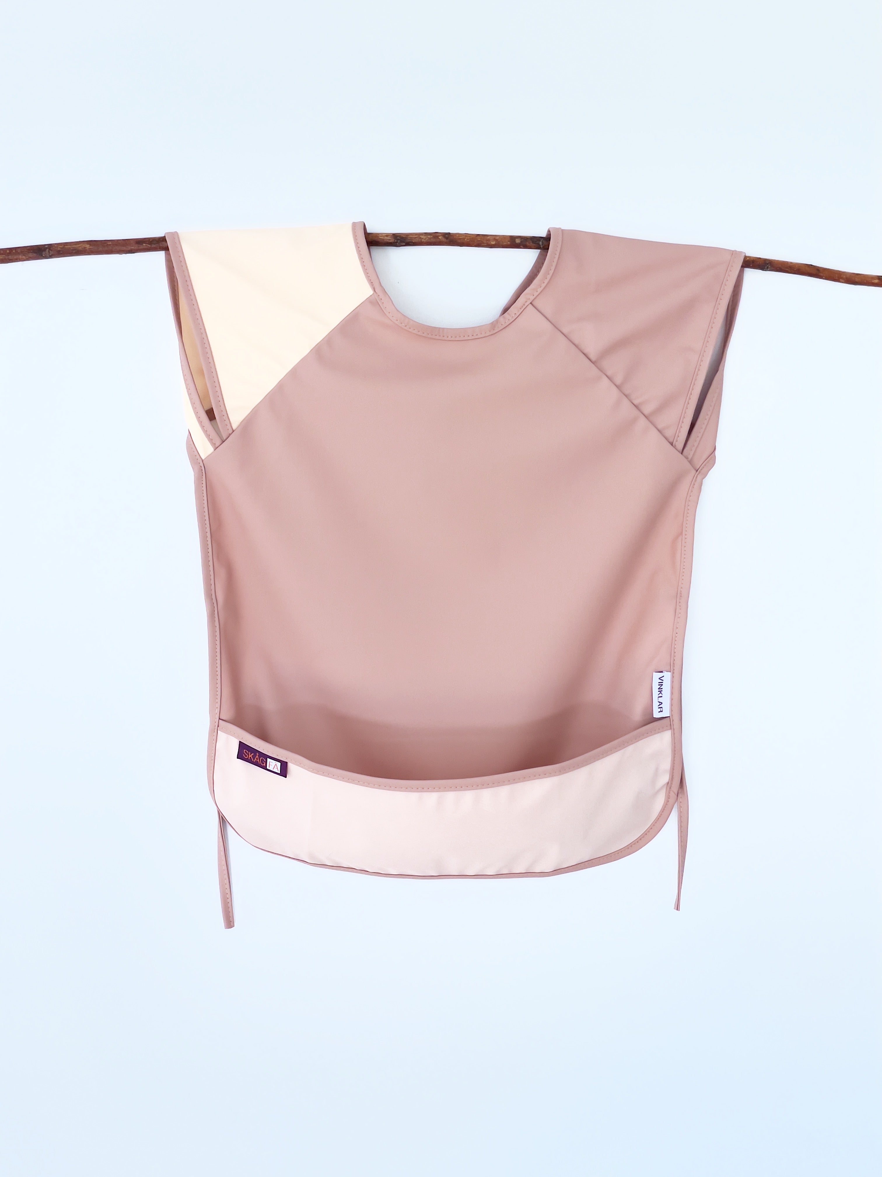 Baby's first apron for family cooking session, featuring colorful and child-friendly design, perfect for engaging young children in kitchen activities safely. pink color