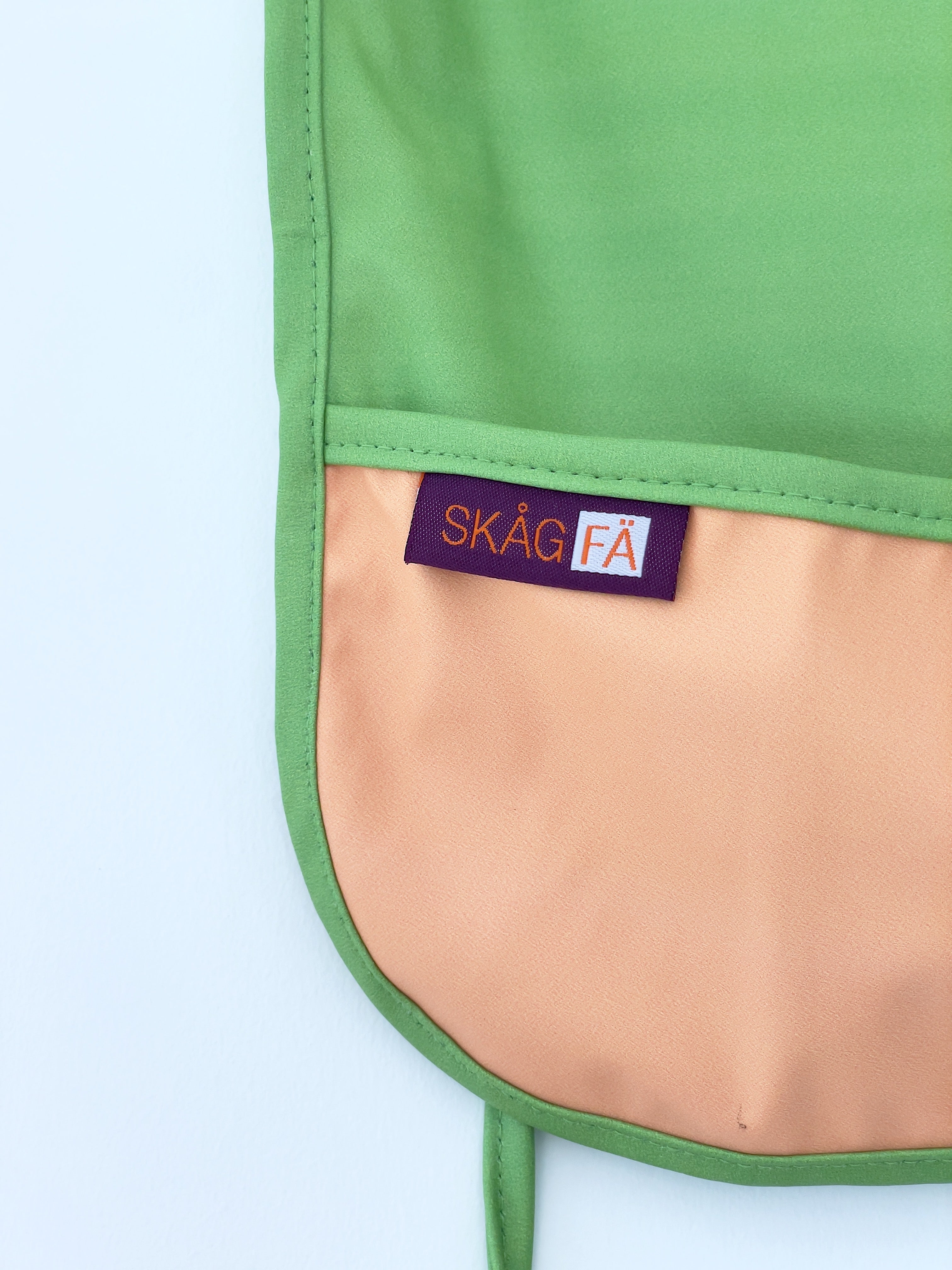 Baby's first apron for family cooking session, featuring colorful and child-friendly design, perfect for engaging young children in kitchen activities safely. Award winner company brand