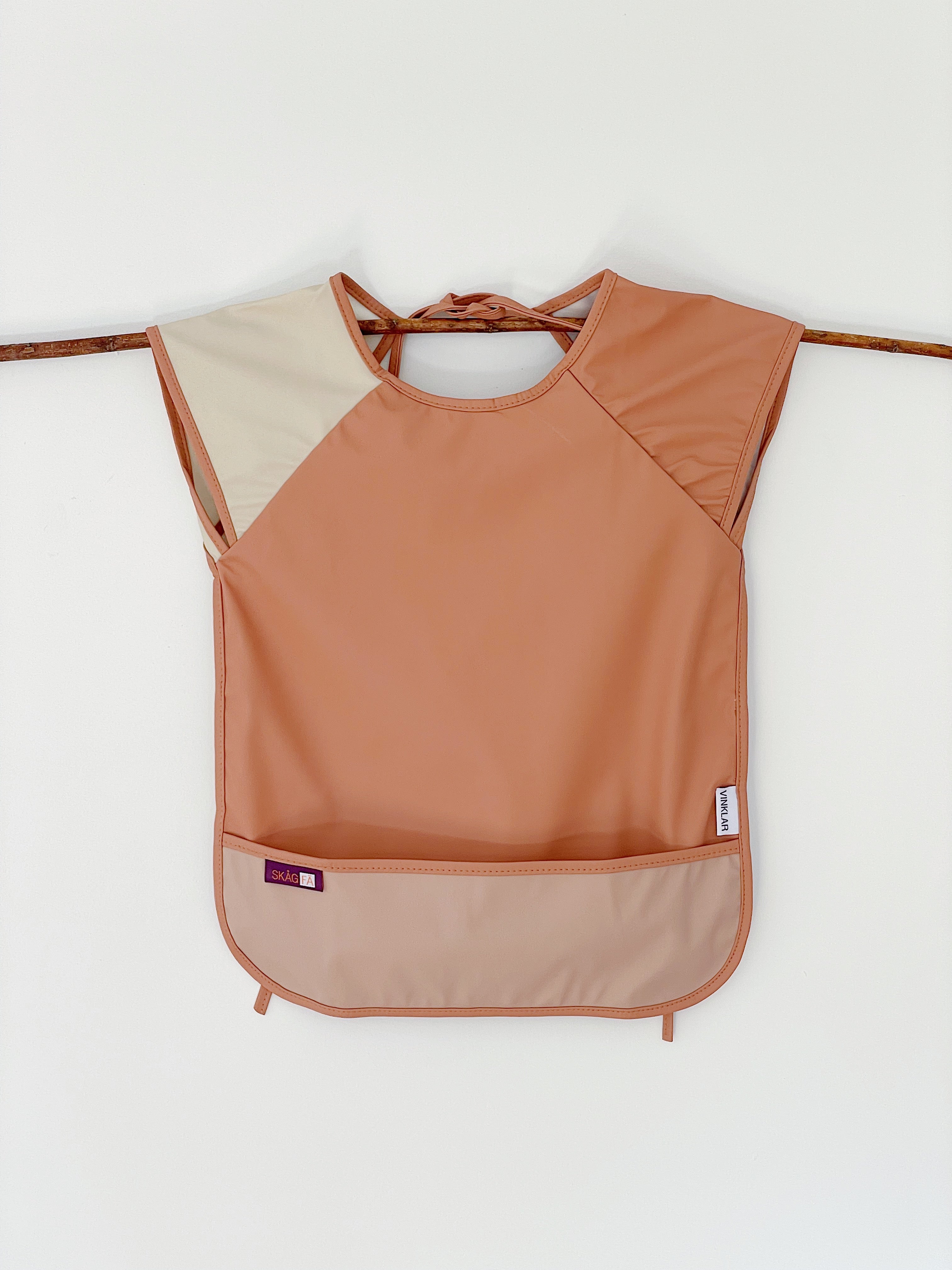 Baby's first apron for family cooking session, featuring colorful and child-friendly design, perfect for engaging young children in kitchen activities safely. Award winner company brand , Terracotta Nature color