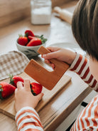 Children’s wooden knife - Ideal for educational play at home, this child-safe knife is a key tool in both Montessori and Waldorf educational methods. Explore our versatile, wooden educational toys that empower parents and attract retailers looking for the latest innovations in safe and developmental children’s products. Perfect for engaging young minds in practical life skills.